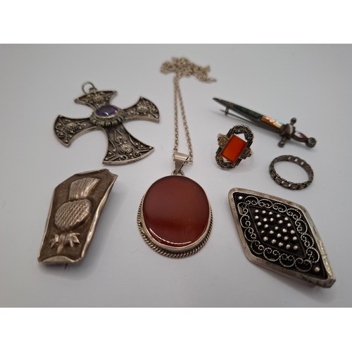 54 - A small quantity of silver and white metal jewellery to include a diamond shaped brooch stamped 800,... 