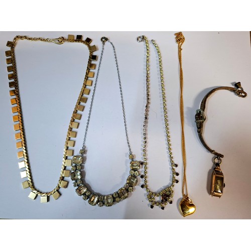 57 - A quantity of vintage costume jewellery to include a small 9ct gold ladies cocktail watch dial stamp... 