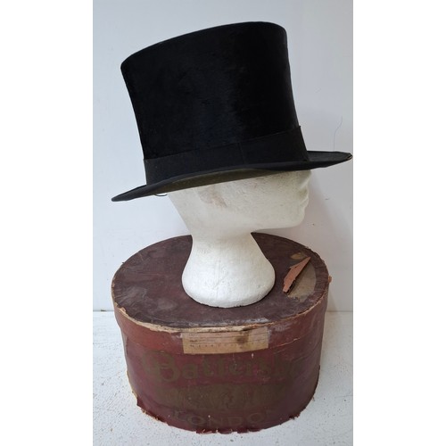 An early 20th Century Best Quality black silk top hat, internal
