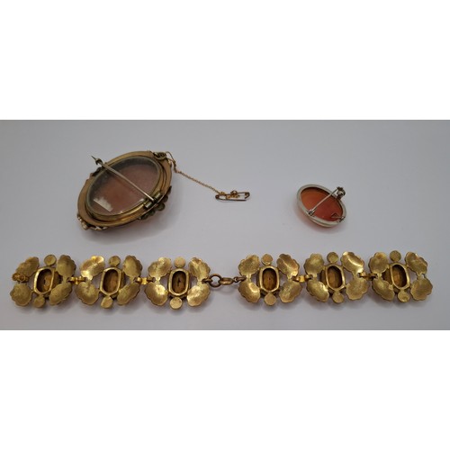 55 - A Victorian swivel cameo brooch in a gold plated mount, a 20th Century silver set cameo brooch and a... 