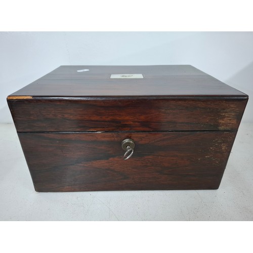 52 - A Georgian rosewood dressing box A/F with fitted interior, key and contents to include glass bottles... 