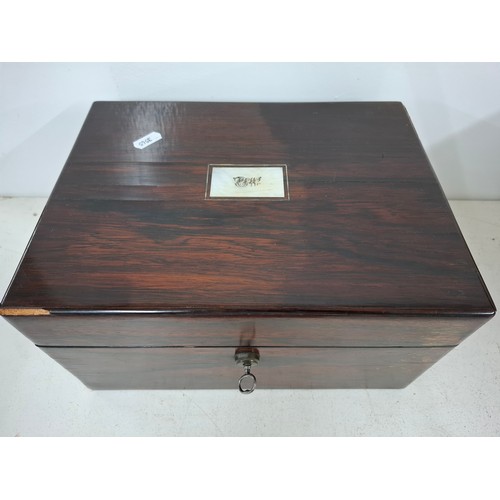 52 - A Georgian rosewood dressing box A/F with fitted interior, key and contents to include glass bottles... 