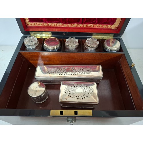 52 - A Georgian rosewood dressing box A/F with fitted interior, key and contents to include glass bottles... 