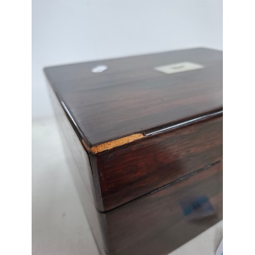 52 - A Georgian rosewood dressing box A/F with fitted interior, key and contents to include glass bottles... 