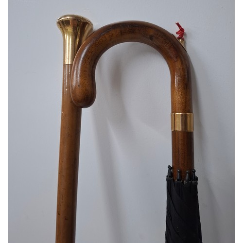 40 - A Briggs London black umbrella with inset pencil having a gold tone collar signed Briggs together wi... 