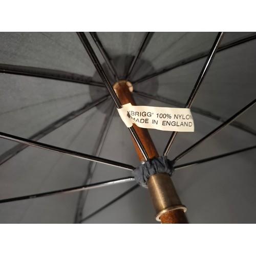 40 - A Briggs London black umbrella with inset pencil having a gold tone collar signed Briggs together wi... 
