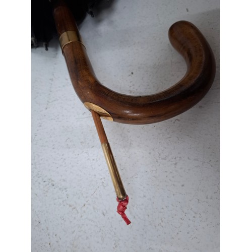 40 - A Briggs London black umbrella with inset pencil having a gold tone collar signed Briggs together wi... 