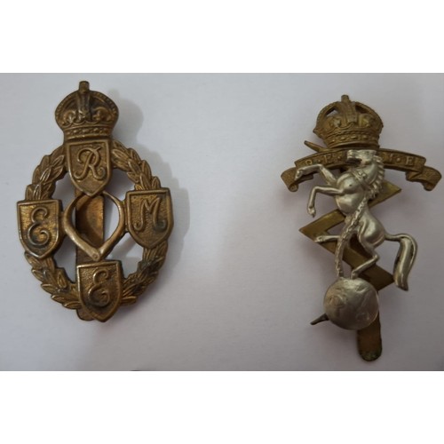 58 - A quantity of cap badges, vintage badges and medals to include mid 20th Century silver football meda... 