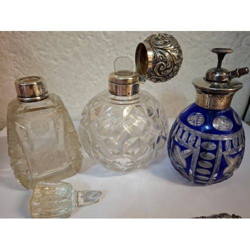 45 - Three silver topped/collared glass scent bottles to include a blue flash cut example, makers marks R... 