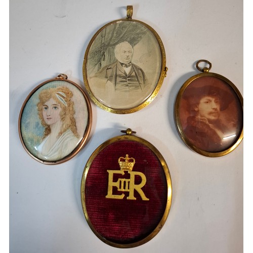 27 - A large Victorian Pinchbeck framed mourning pendant depicting a portrait of an elderly gent, the rev... 