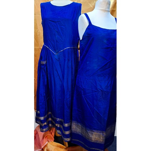 47 - A vintage cobalt blue silk sleeveless dress with gold coloured trim approx 38