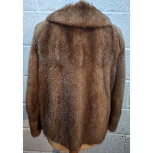 51 - A mid 20th Century mid brown mink jacket having 2 pockets, buttoned cuffs and olive green lining, ap... 
