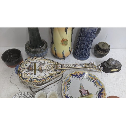 62 - A collection of ceramics to include a Majolica wall pocket fashioned as a mandolin, a late 18th cent... 