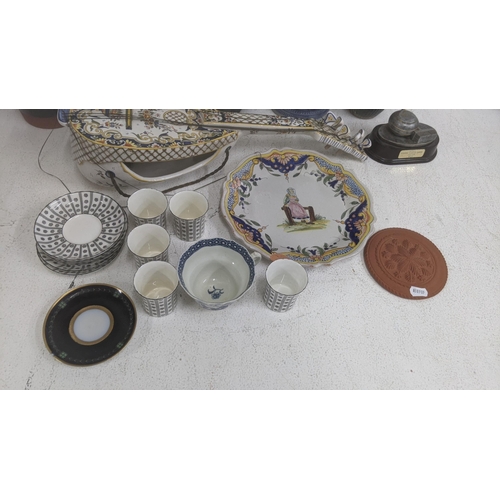 62 - A collection of ceramics to include a Majolica wall pocket fashioned as a mandolin, a late 18th cent... 