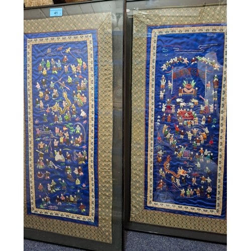 41 - Four framed Oriental embroidered silk panels to include a pair of Chinese blue silk panels depicting... 