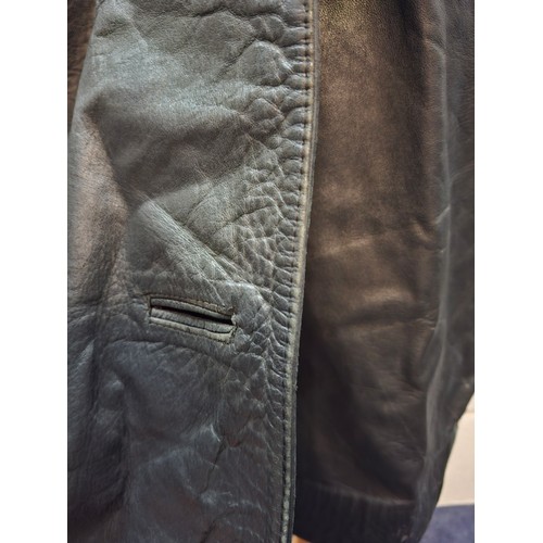 9 - Pierre Balmain-An early 1960's ladies black alligator coat having 2 front pockets and red lining, ap... 