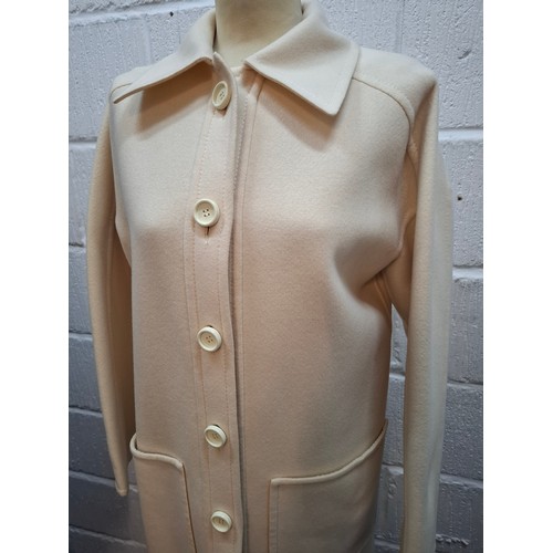13 - Lanvin- A 1970's cream wool mix ladies coat with 2 front deep pockets and 5 cream button front faste... 