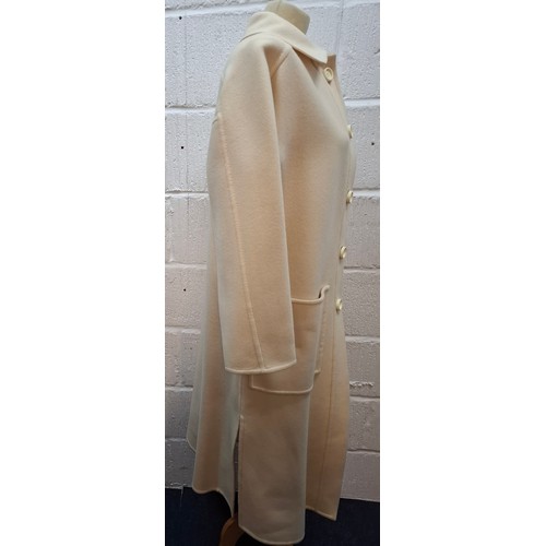 13 - Lanvin- A 1970's cream wool mix ladies coat with 2 front deep pockets and 5 cream button front faste... 