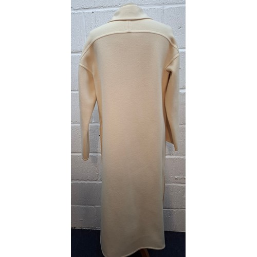 13 - Lanvin- A 1970's cream wool mix ladies coat with 2 front deep pockets and 5 cream button front faste... 