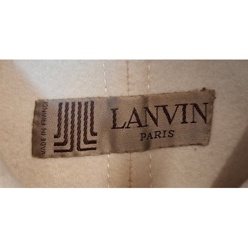 13 - Lanvin- A 1970's cream wool mix ladies coat with 2 front deep pockets and 5 cream button front faste... 
