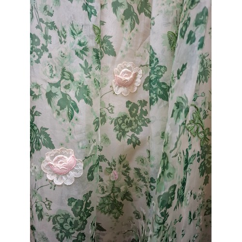 20 - Two vintage dresses comprising a mid 20th Century Forelle Cappa green netted tea length dress A/F wi... 