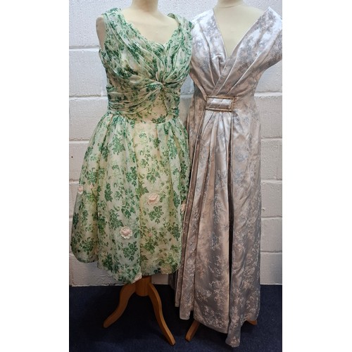 20 - Two vintage dresses comprising a mid 20th Century Forelle Cappa green netted tea length dress A/F wi... 