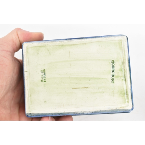 104 - A group of early/mid 20th century Moorcroft pottery to include a 'pomegranate' patter pewter mounted... 