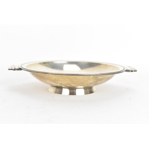 110 - Georg Jensen - a sterling silver 'Pyramid' round dish, having a polished shallow bowl with stepped f... 