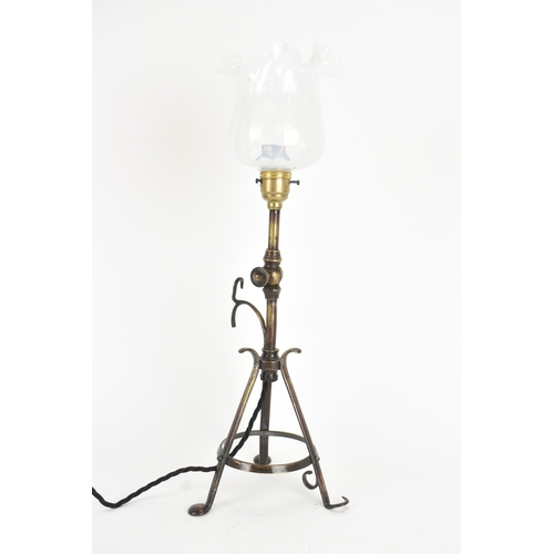 13 - An early 20th century Pullman railway carriage lamp, the adjustable column with wrought metal tripod... 