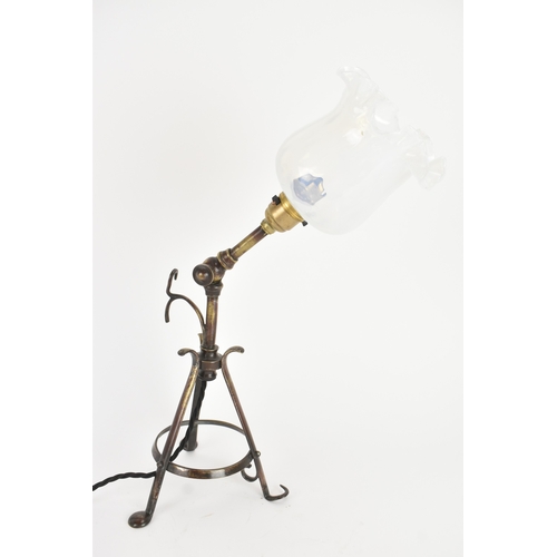 13 - An early 20th century Pullman railway carriage lamp, the adjustable column with wrought metal tripod... 