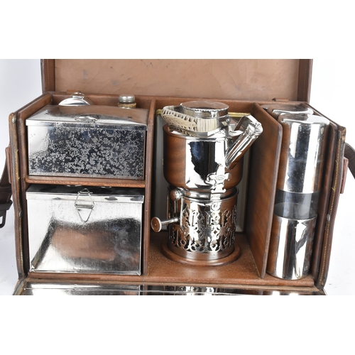 179 - An early 20th century Drew & Sons Picadilly Circus 'En Route' picnic set,  in a brown leather travel... 