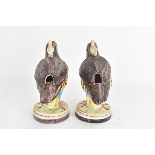 180 - A pair of 18th-century Alcora Talavera faience partridge tureens, circa 1790, with original domed co... 