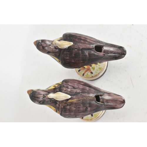 180 - A pair of 18th-century Alcora Talavera faience partridge tureens, circa 1790, with original domed co... 