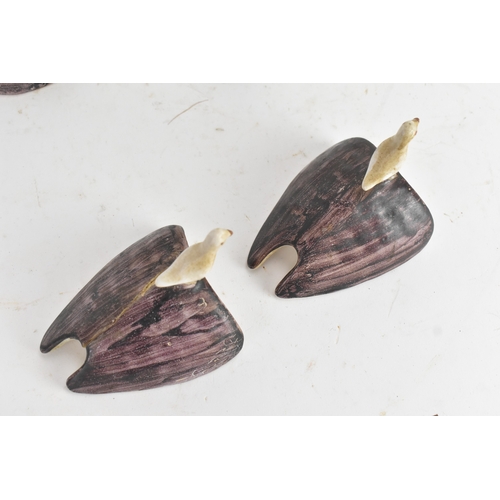 180 - A pair of 18th-century Alcora Talavera faience partridge tureens, circa 1790, with original domed co... 