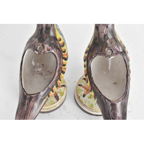 180 - A pair of 18th-century Alcora Talavera faience partridge tureens, circa 1790, with original domed co... 