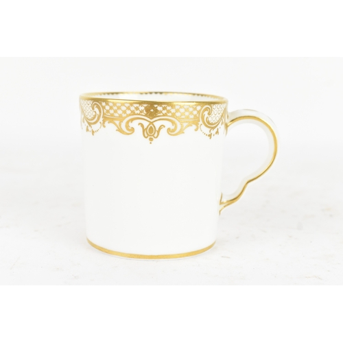 182 - A late 18th century Sèvres porcelain coffee can, decorated in gilt with a neoclassical frieze of scr... 