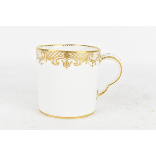 182 - A late 18th century Sèvres porcelain coffee can, decorated in gilt with a neoclassical frieze of scr... 