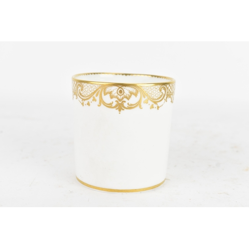 182 - A late 18th century Sèvres porcelain coffee can, decorated in gilt with a neoclassical frieze of scr... 