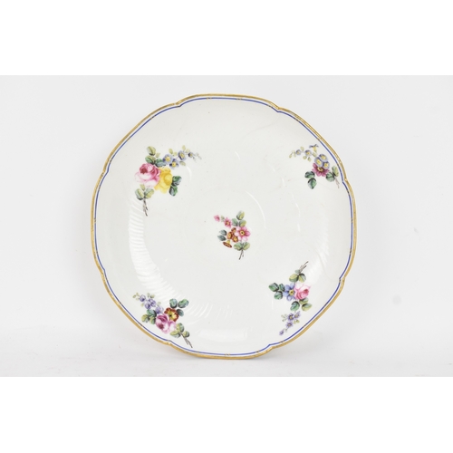184 - An 18th century Sèvres porcelain lobed dish, painted with finely detailed scattered floral sprays wi... 