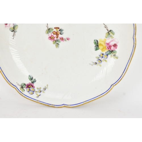 184 - An 18th century Sèvres porcelain lobed dish, painted with finely detailed scattered floral sprays wi... 