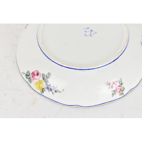 184 - An 18th century Sèvres porcelain lobed dish, painted with finely detailed scattered floral sprays wi... 