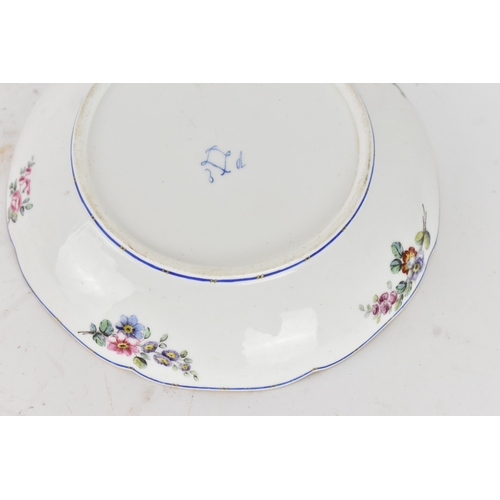 184 - An 18th century Sèvres porcelain lobed dish, painted with finely detailed scattered floral sprays wi... 