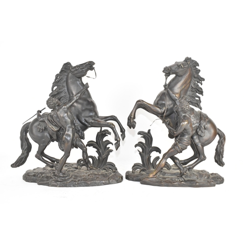 187 - A pair of late 19th/early 20th century French patinated bronze models of the Marly Horses, after Gui... 