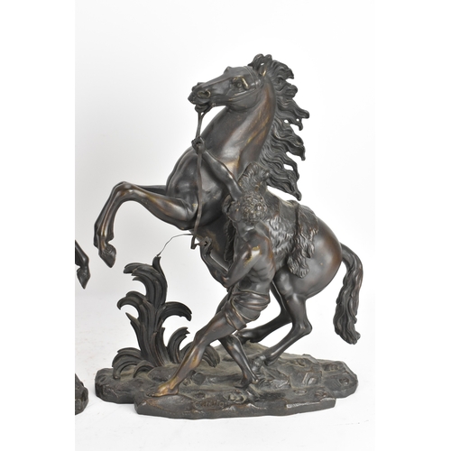 187 - A pair of late 19th/early 20th century French patinated bronze models of the Marly Horses, after Gui... 