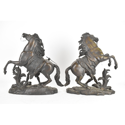 187 - A pair of late 19th/early 20th century French patinated bronze models of the Marly Horses, after Gui... 