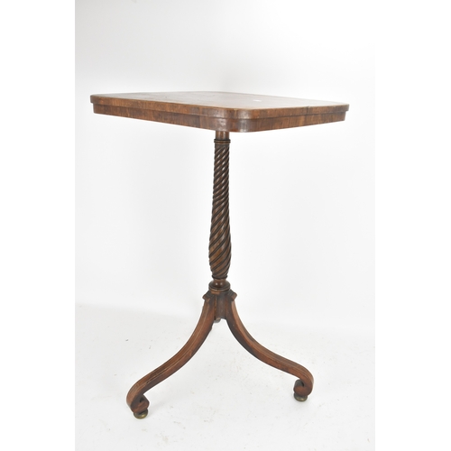 189 - A pair of Regency rosewood lamp tables, the rectangular tops with rounded corners, raised on spiral-... 