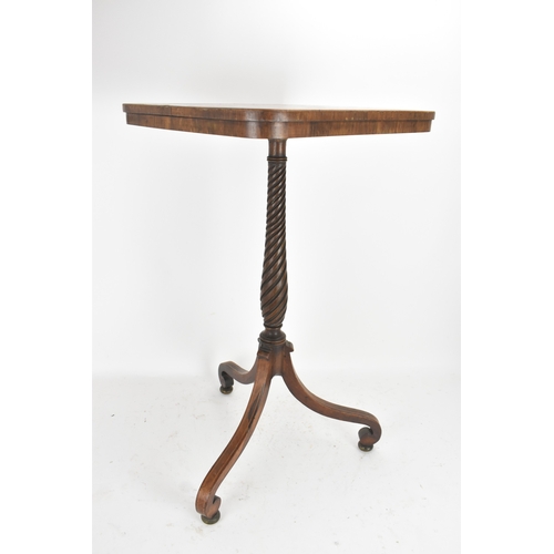 189 - A pair of Regency rosewood lamp tables, the rectangular tops with rounded corners, raised on spiral-... 