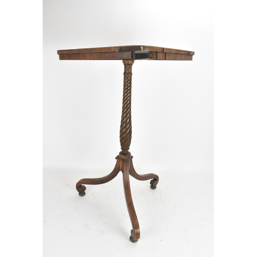 189 - A pair of Regency rosewood lamp tables, the rectangular tops with rounded corners, raised on spiral-... 