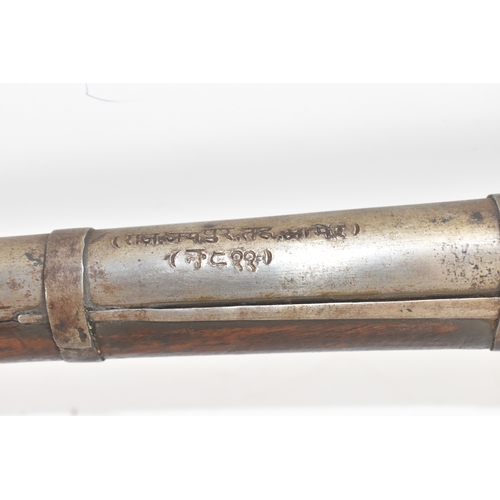 192 - A 19th century Indian toradar matchlock musket, the long steel barrel engraved with inscription, the... 