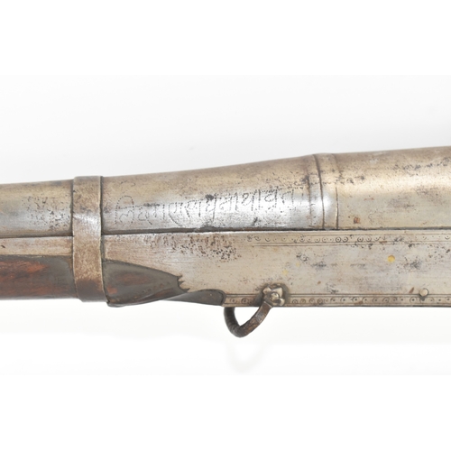 192 - A 19th century Indian toradar matchlock musket, the long steel barrel engraved with inscription, the... 